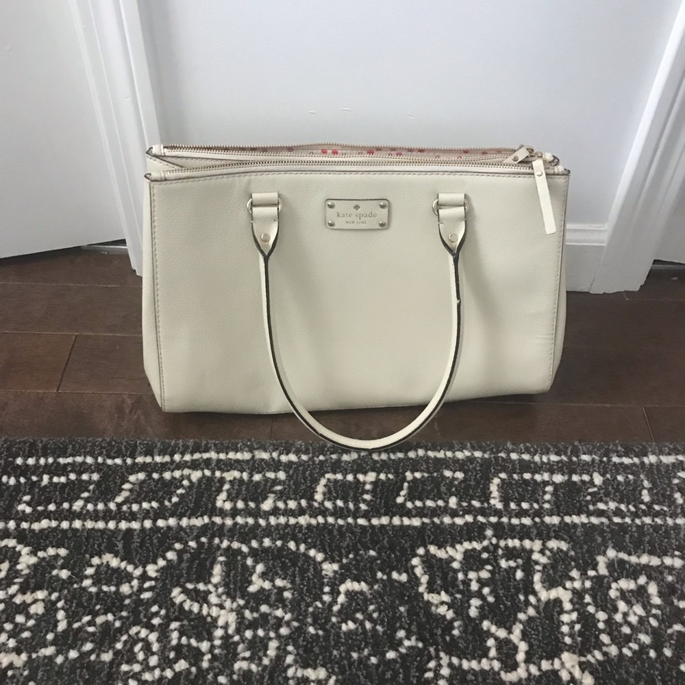 KateSpade handbag- true ivory color. 15 ‘ long. Used once.